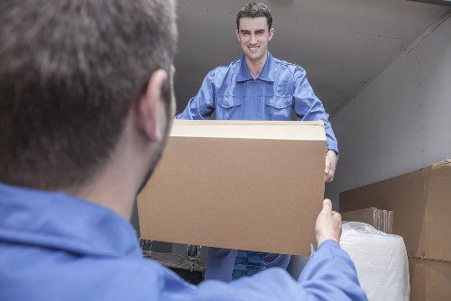Professional movers working safely with insured removals