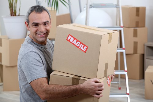 Packed office boxes and labelled items for a commercial move
