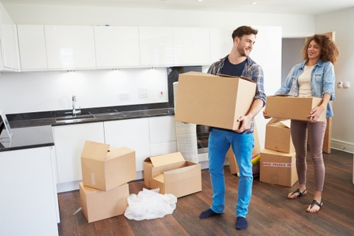 Furniture and boxes being loaded into a moving van in Greenwich