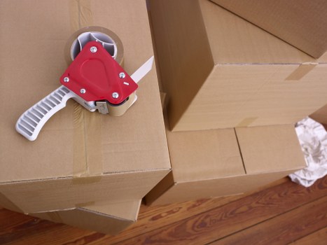 Packed moving boxes ready for transport in Greenwich