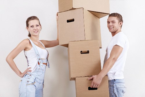 Local movers carrying furniture from a Greenwich property
