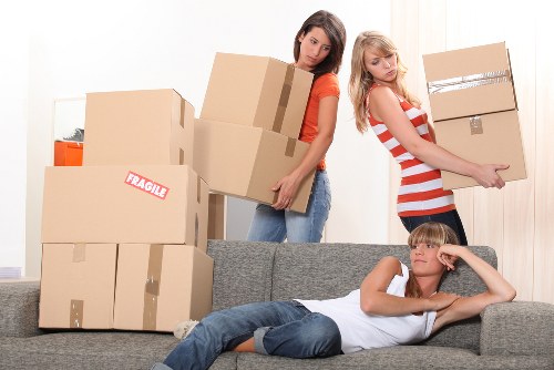 Packed boxes and furniture loaded into a removal van
